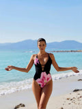 2026 New Women's One-Piece Swimsuit: Black With Large Pink Lily Print, Plunge V-Neck, Thin Straps And Ruched Tummy Control